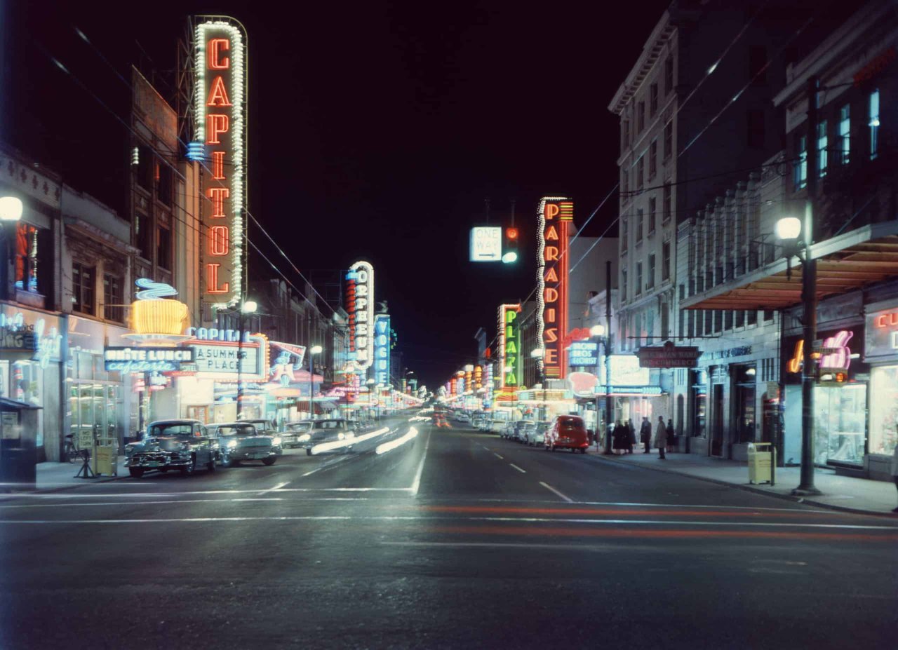 A view of Granville Street in 1959 featuring the Orpheum's neon sign. City of Vancouver Archives, CVA 672-1.