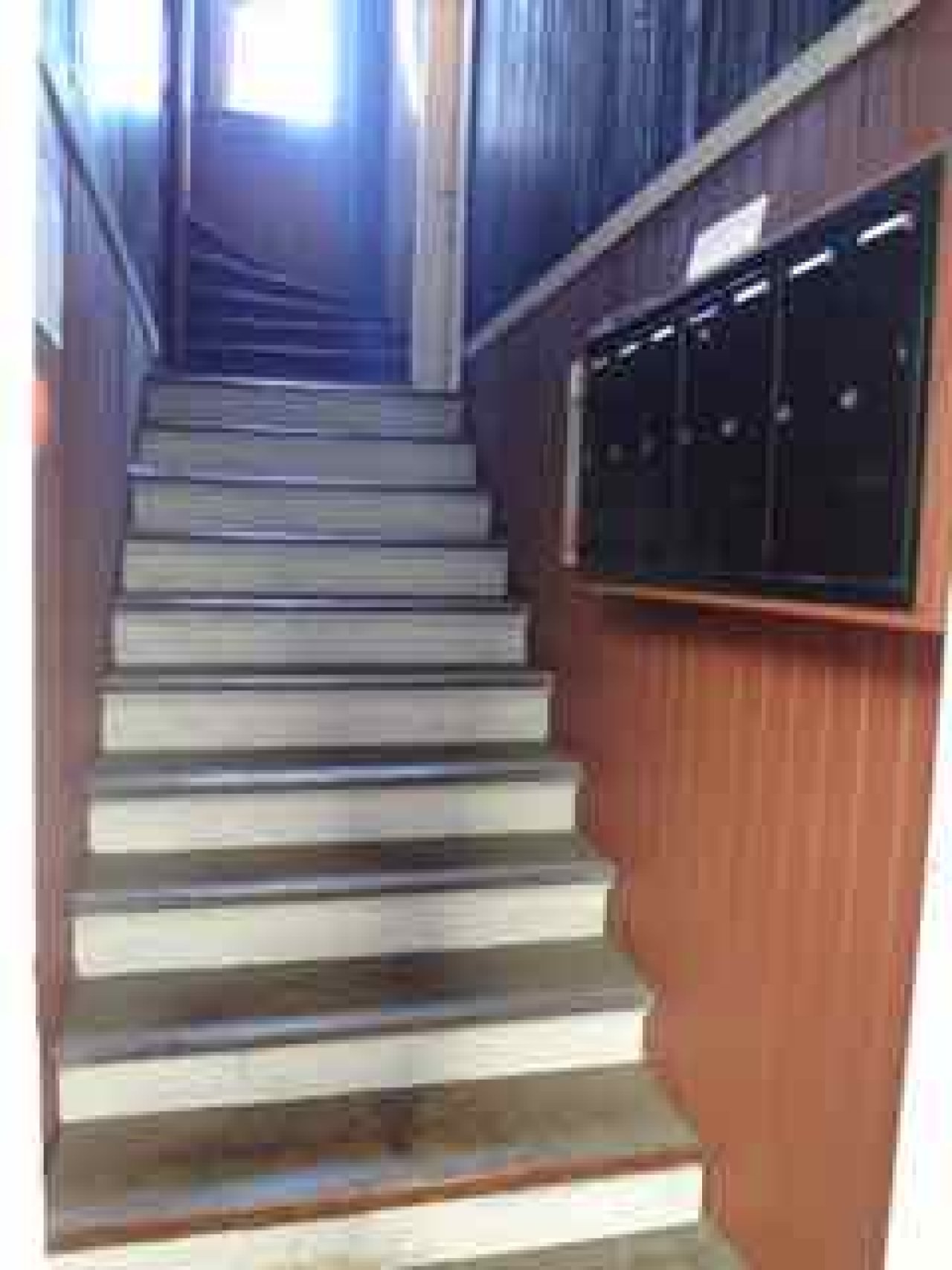 Entryway and stairs at the Takehara/Yada Apartments, 1017 W 7th Avenue. Courtesy of Kathy Harris
